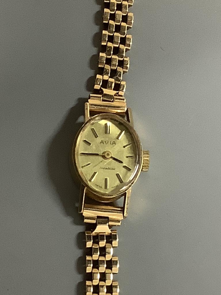A 9ct gold Avia ladies' wristwatch on integral 9ct gold bracelet, gross 14.5 grams.
